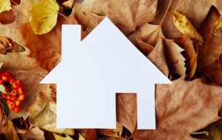 white paper house on fall leaves